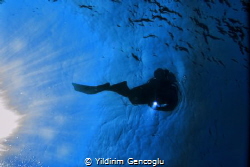 Diver sun&torch by Yildirim Gencoglu 